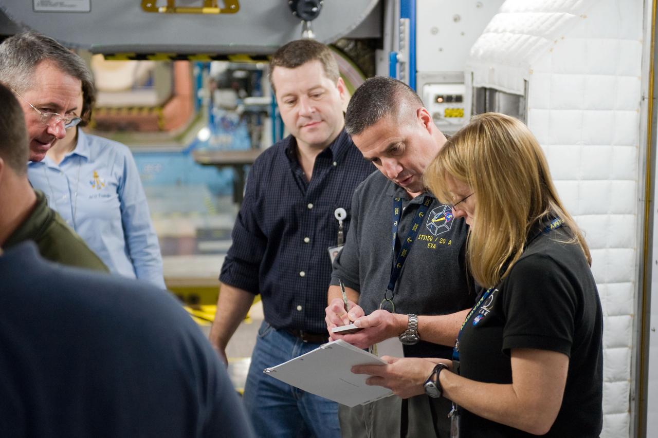 JSC2009-E-258425 (8 Dec. 2009) --- Astronaut George Zamka (second right), STS-130 commander; along with astronauts Kathryn Hire, Nicholas Patrick and Stephen Robinson (mostly out of frame at left), all mission specialists, participate in a training session in an International Space Station mock-up/trainer in the Space Vehicle Mock-up Facility at NASA's Johnson Space Center.