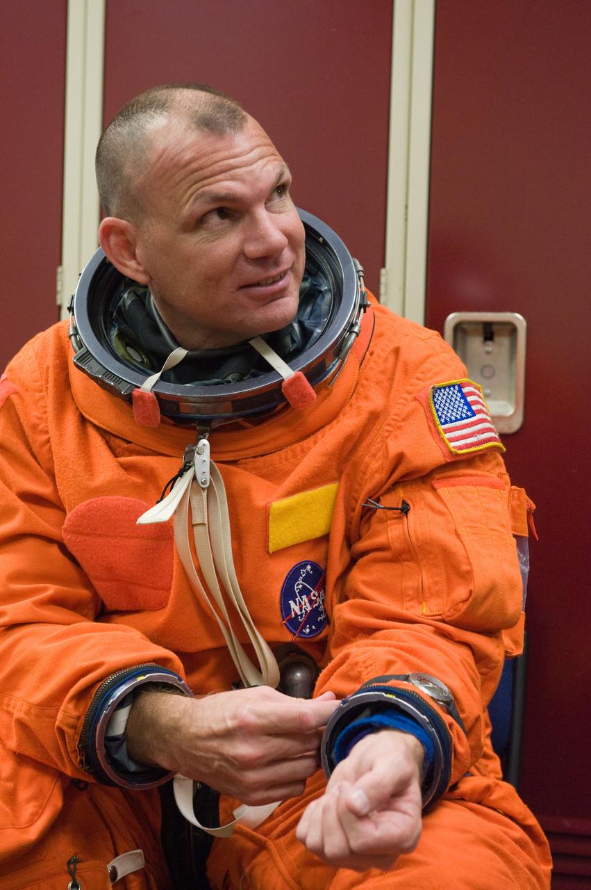 JSC2009-E-258449 (8 Dec. 2009) --- Astronaut Tony Antonelli, STS-132 pilot, attired in a training version of his shuttle launch and entry suit, awaits the start of a training session in the Space Vehicle Mock-up Facility at NASA's Johnson Space Center.
