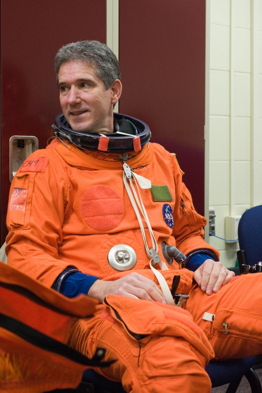 JSC2009-E-258450 (8 Dec. 2009) --- Astronaut Mike Good, STS-132 mission specialist, attired in a training version of his shuttle launch and entry suit, awaits the start of a training session in the Space Vehicle Mock-up Facility at NASA's Johnson Space Center.