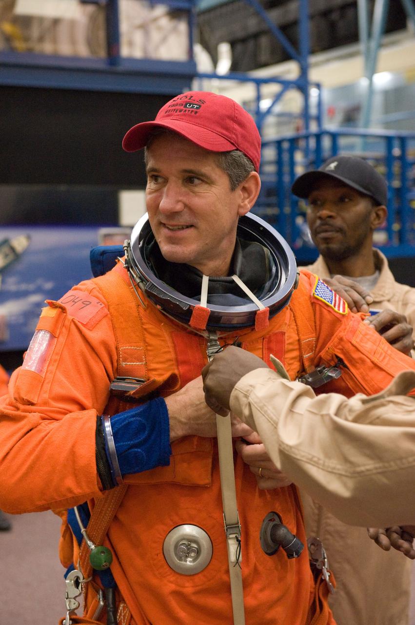 JSC2009-E-258460 (8 Dec. 2009) --- Astronaut Mike Good, STS-132 mission specialist, dons a training version of his shuttle launch and entry suit in preparation for a training session in the Space Vehicle Mock-up Facility at NASA's Johnson Space Center.