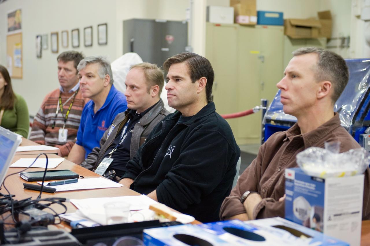JSC2009-E-284891 (15 Dec. 2009) --- STS-134 crew members participate in an EVA Thermal Protection System (TPS) overview training session in the TPS/ Precision Air Bearing Facility in the Space Vehicle Mock-up Facility at NASA?s Johnson Space Center. Pictured from the right are NASA astronauts Andrew Feustel, Greg Chamitoff, Michael Fincke, all mission specialists; along with NASA astronaut Gregory H. Johnson, pilot; and European Space Agency astronaut Roberto Vittori, mission specialist.