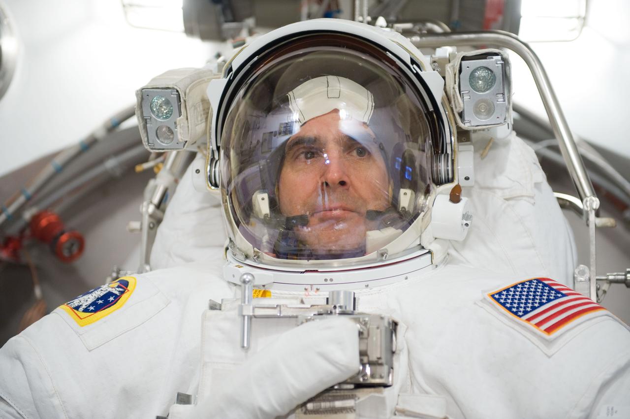 JSC2009-E-285103 (16 Dec. 2009) --- Astronaut Rick Mastracchio, STS-131 mission specialist, participates in an Extravehicular Mobility Unit (EMU) spacesuit fit check in the Space Station Airlock Test Article (SSATA) in the Crew Systems Laboratory at NASA's Johnson Space Center.