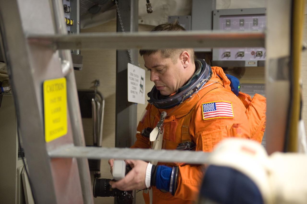 JSC2009-E-286679 (21 Dec. 2009) --- Astronaut Robert Behnken, STS-130 mission specialist, attired in a training version of his shuttle launch and entry suit, participates in a training session in the Mission Simulation Development Facility at NASA's Johnson Space Center.
