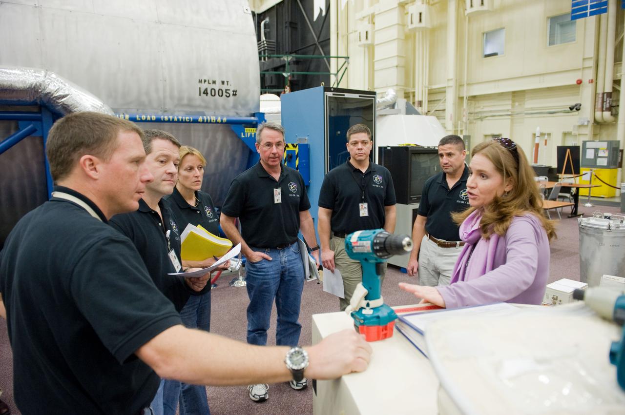 JSC2009-E-286839 (21 Dec. 2009) --- The STS-130 crew members participate in a training session in the Space Vehicle Mock-up Facility at NASA's Johnson Space Center. Pictured from the second right are astronauts George Zamka, commander; Robert Behnken, Stephen Robinson, Kathryn Hire, Nicholas Patrick, all mission specialists; and Terry Virts, pilot.