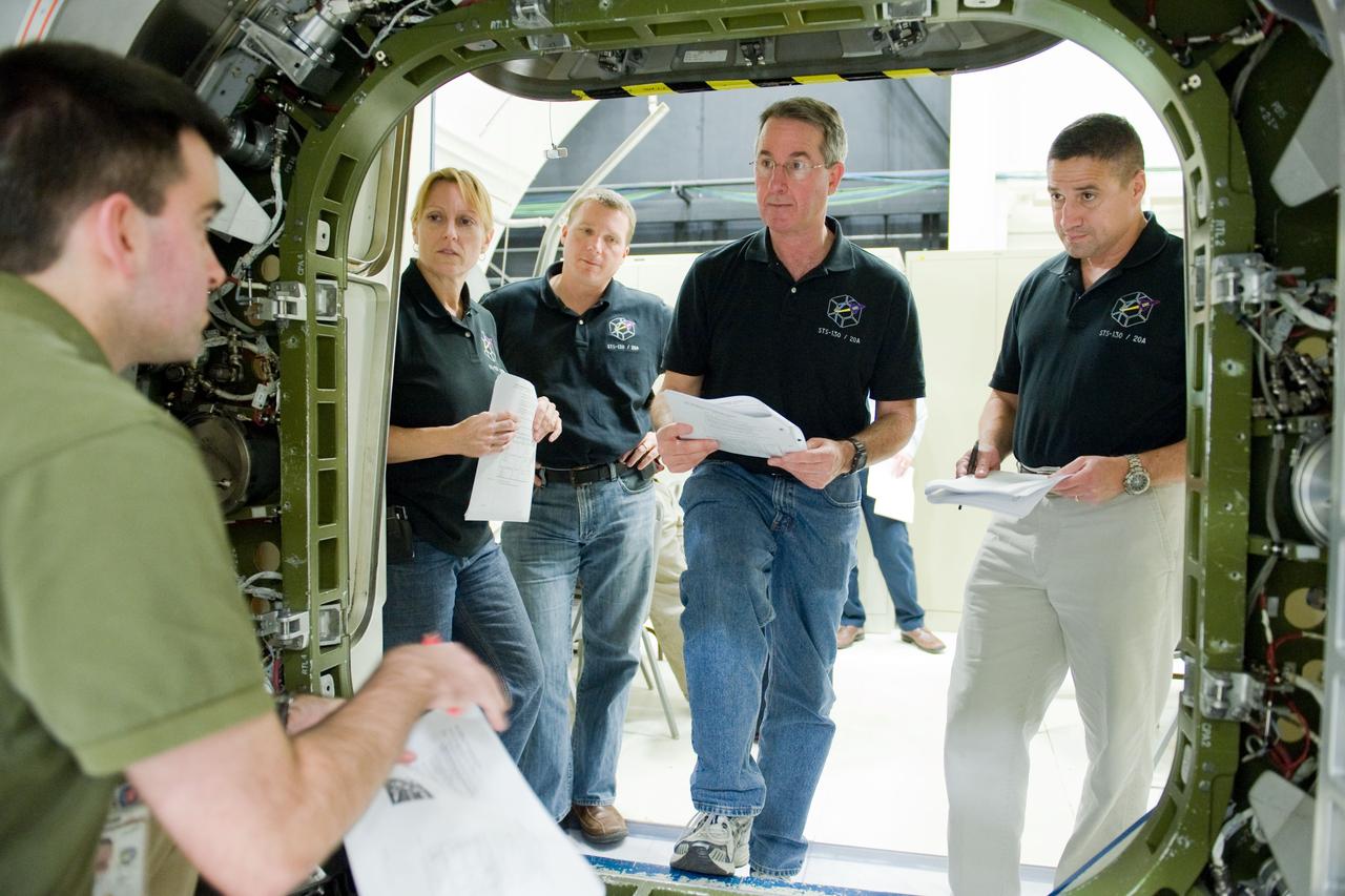 JSC2009-E-286844 (21 Dec. 2009) --- STS-130 crew members participate in a training session in an International Space Station mock-up/trainer in the Space Vehicle Mock-up Facility at NASA's Johnson Space Center. Pictured from the right are astronauts George Zamka, commander; Stephen Robinson, mission specialist; Terry Virts, pilot; and Kathryn Hire, mission specialist.
