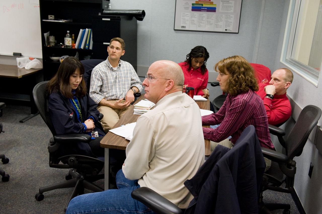 JSC2010-E-006681 (5 Jan. 2010) --- STS-131 crew members participate in an undocking timeline training session in the Mission Simulation Development Facility at NASA's Johnson Space Center. Pictured clockwise from the foreground are NASA astronaut Alan Poindexter, commander; Japan Aerospace Exploration Agency (JAXA) astronaut Naoko Yamazaki, mission specialist; NASA astronauts James P. Dutton Jr., pilot; Stephanie Wilson, Clayton Anderson and Dorothy Metcalf-Lindenburger, all mission specialists.