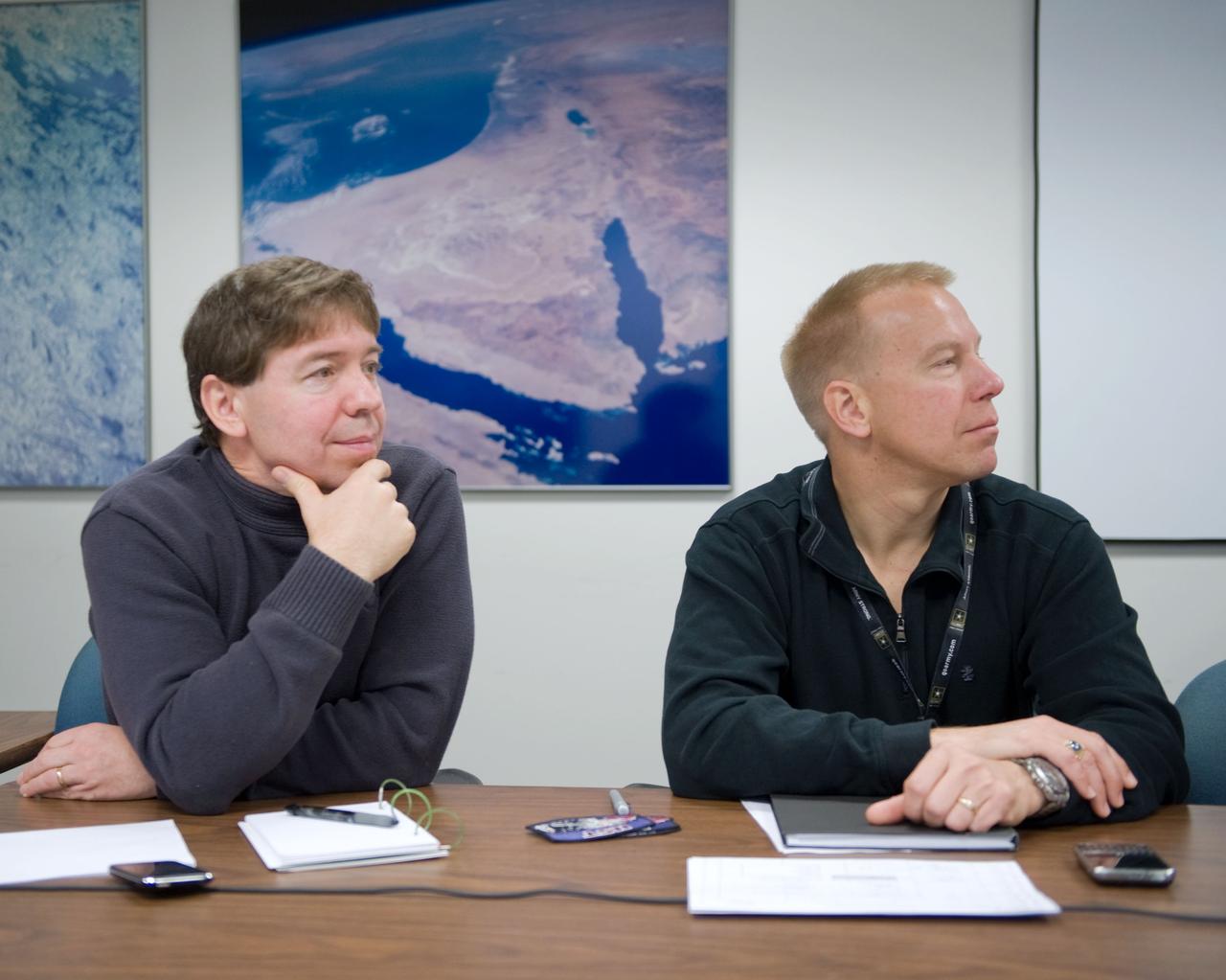 JSC2010-E-006721 (5 Jan. 2010) --- NASA astronauts Michael Barratt (left) and Tim Kopra, both STS-133 mission specialists, are pictured during a training scheduling session at NASA?s Johnson Space Center.