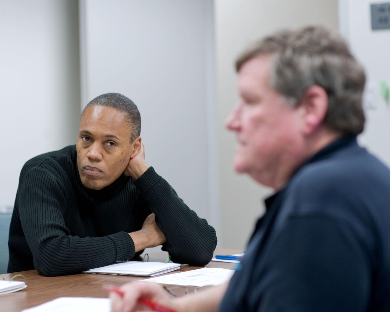 JSC2010-E-006724 (5 Jan. 2010) --- NASA astronaut Alvin Drew (facing camera), STS-133 mission specialist, is pictured during a training scheduling session at NASA?s Johnson Space Center with scheduler Dale Williamson.