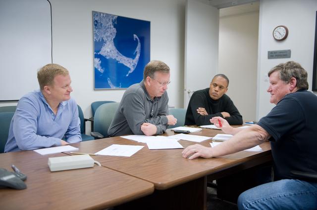 NASA image: STS-133 (Last Shuttle Mission) crew during their meeting with their scheduler Dale Williamson 