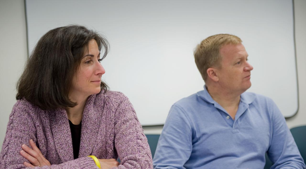 JSC2010-E-006728 (5 Jan. 2010) --- NASA astronauts Eric Boe, STS-133 pilot; and Nicole Stott, mission specialist, are pictured during a training scheduling session at NASA?s Johnson Space Center.