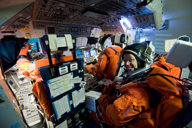 NASA image: STS-133 crew members Lindsey, Boe, Drew and Kopra for Motion Base Ascent Skill 32011 training 