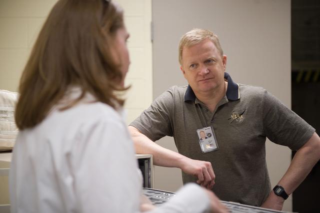 NASA image: STS-133 crew members Lindsey, Boe and Drew during Tool/Repair Kits training with instructor 