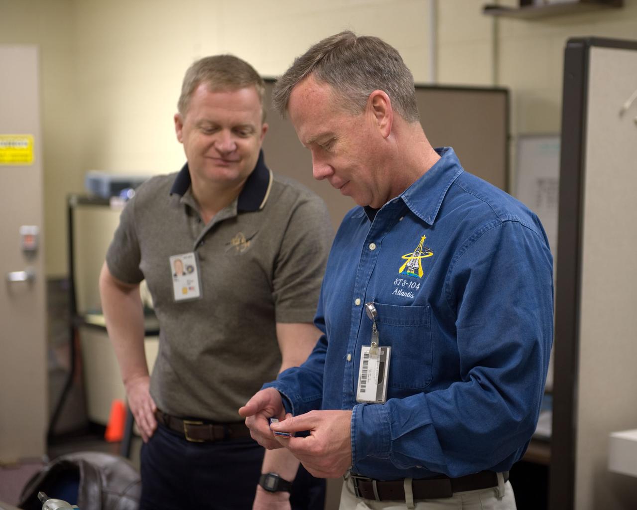 JSC2010-E-014266 (26 Jan. 2010) --- NASA astronauts Steve Lindsey (right), STS-133 commander; and Eric Boe, pilot, participate in an ISS tools and repair kits training session in the Space Vehicle Mock-up Facility at NASA's Johnson Space Center.