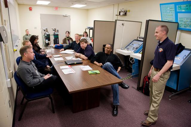 NASA image: STS-133 crew during STS Response to Joint Emergency training with instructor Troy Williams