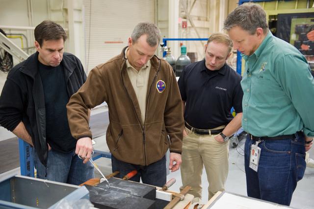NASA image: STS-134 crew members Mike Fincke, Drew Feustel and Greg Chamitoff performing EVA Tile Repair Training. 
