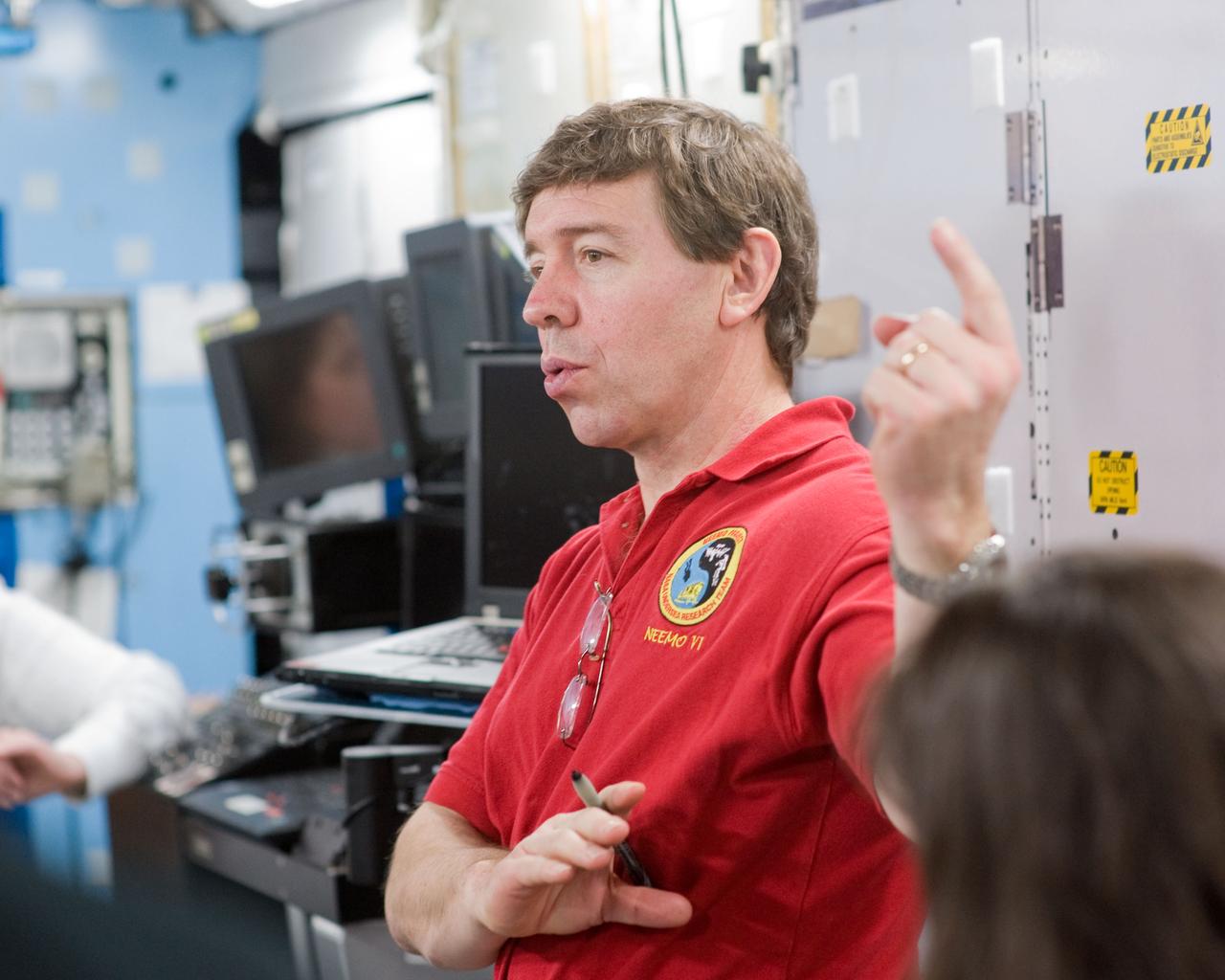 JSC2010-E-017952 (2 Feb. 2010) --- NASA astronaut Michael Barratt, STS-133 mission specialist, participates in a training session in an International Space Station mock-up/trainer in the Space Vehicle Mock-up Facility at NASA's Johnson Space Center.