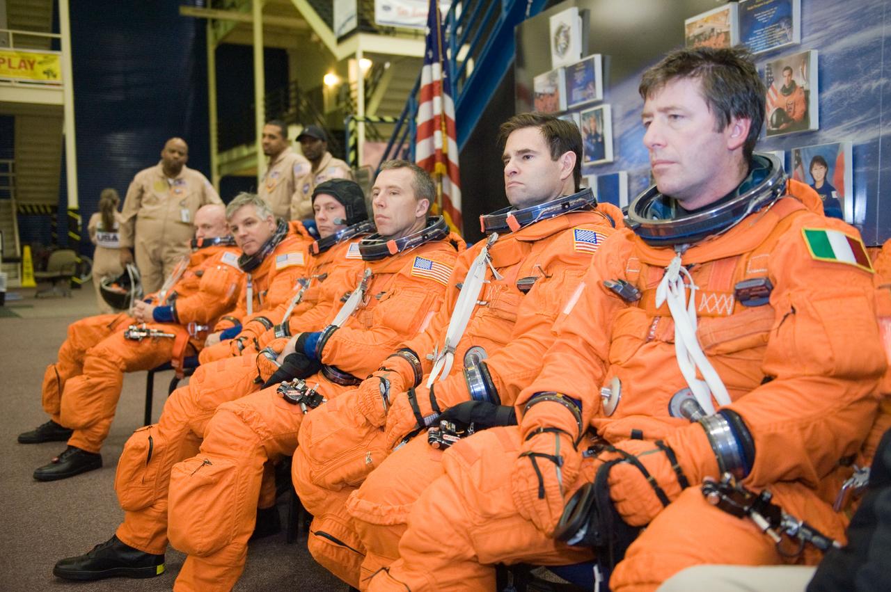 JSC2010-E-018511 (3 Feb. 2010) --- Attired in training versions of their shuttle launch and entry suits, the STS-134 crew members await the start of a training session in the Space Vehicle Mock-up Facility at NASA's Johnson Space Center. Pictured (left to right) are NASA astronauts Mark Kelly, commander; Gregory H. Johnson, pilot; Michael Fincke, Andrew Feustel, Greg Chamitoff and European Space Agency astronaut Roberto Vittori, all mission specialists.