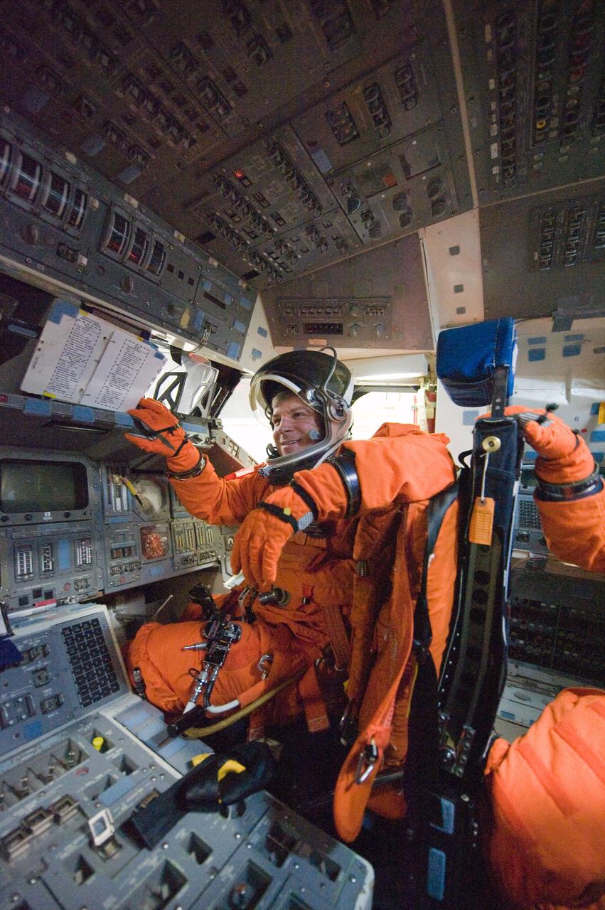 JSC2010-E-018558 (3 Feb. 2010) --- NASA astronaut Gregory H. Johnson, STS-134 pilot, attired in a training version of his shuttle launch and entry suit, occupies the pilot?s station on the flight deck of the Full Fuselage Trainer (FFT) during a training session in the Space Vehicle Mock-up Facility at NASA's Johnson Space Center.