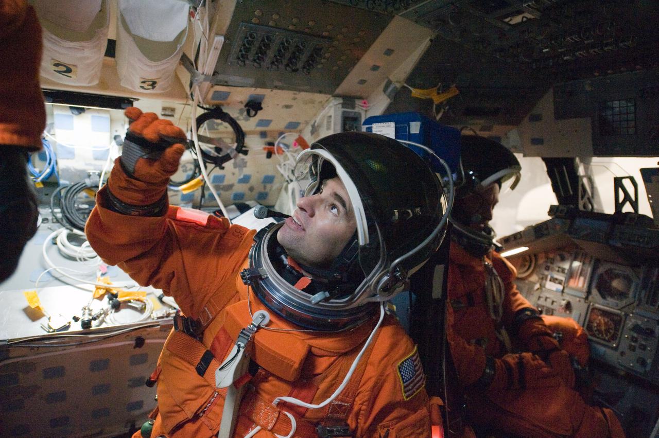 JSC2010-E-018566 (3 Feb. 2010) --- NASA astronaut Greg Chamitoff, STS-134 mission specialist, attired in a training version of his shuttle launch and entry suit, participates in a training session on the flight deck of the Full Fuselage Trainer (FFT) in the Space Vehicle Mock-up Facility at NASA's Johnson Space Center.