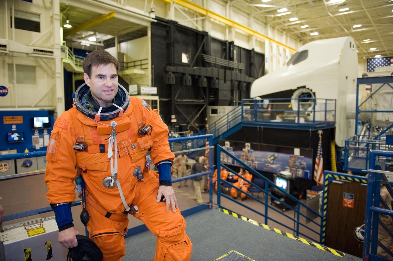 JSC2010-E-018597 (3 Feb. 2010) --- NASA astronaut Greg Chamitoff, STS-134 mission specialist, attired in a training version of his shuttle launch and entry suit, is pictured during a Full Fuselage Trainer (FFT) mock-up training session in the Space Vehicle Mock-up Facility at NASA's Johnson Space Center.