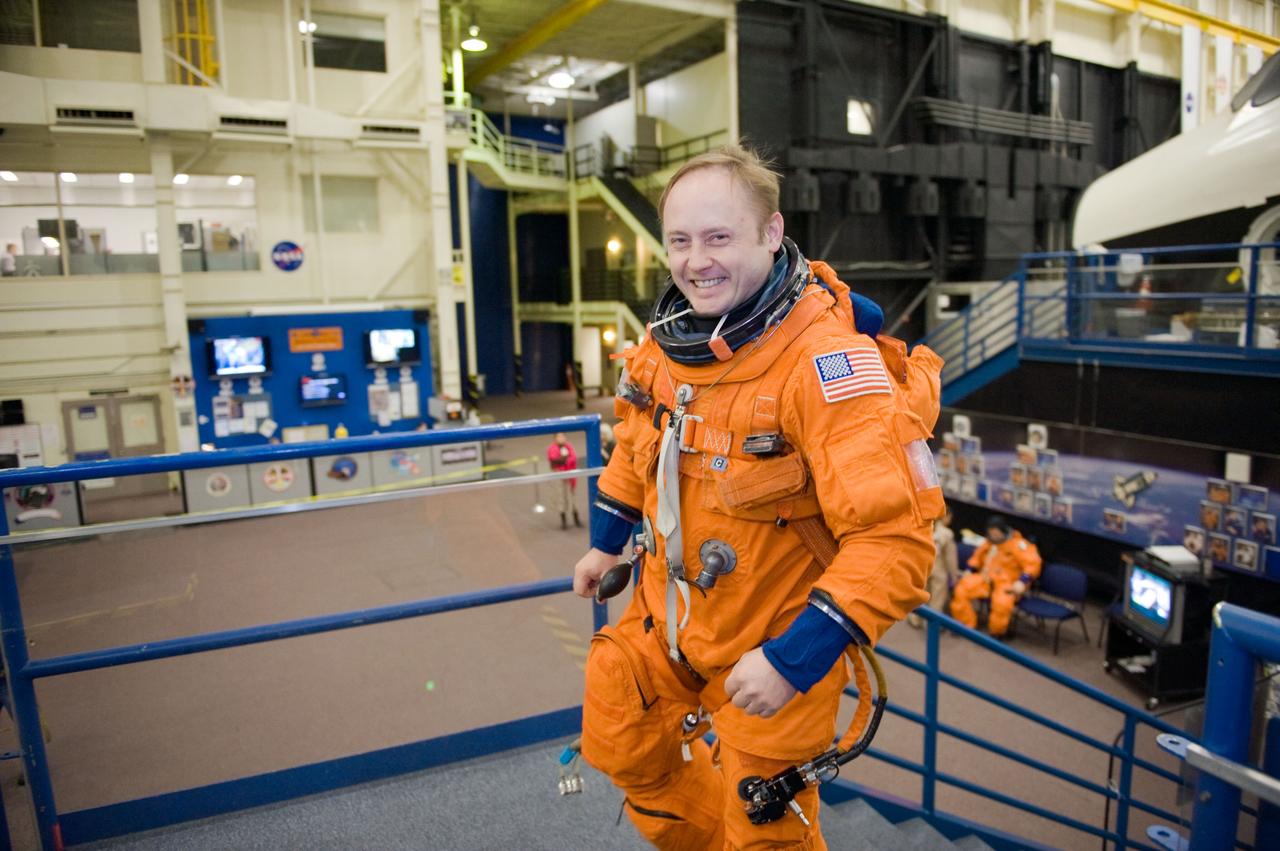 JSC2010-E-018598 (3 Feb. 2010) --- NASA astronaut Michael Fincke, STS-134 mission specialist, attired in a training version of his shuttle launch and entry suit, is pictured during a Full Fuselage Trainer (FFT) mock-up training session in the Space Vehicle Mock-up Facility at NASA's Johnson Space Center.
