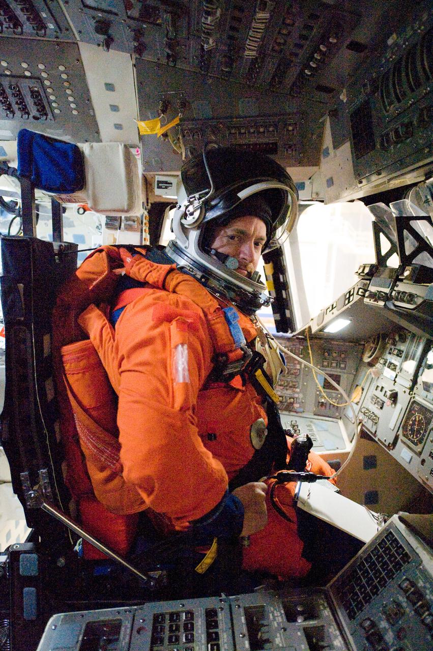 JSC2010-E-018885 (3 Feb. 2010) --- NASA astronaut Mark Kelly, STS-134 commander, attired in a training version of his shuttle launch and entry suit, occupies the commander?s station during a training session on the flight deck of the Full Fuselage Trainer (FFT) in the Space Vehicle Mock-up Facility at NASA's Johnson Space Center.