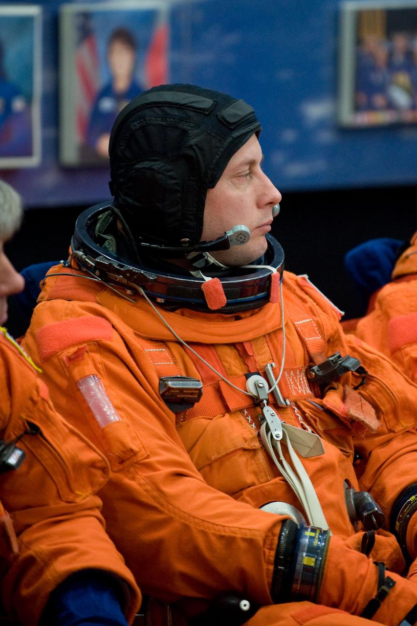 JSC2010-E-018909 (3 Feb. 2010) --- NASA astronaut Michael Fincke, STS-134 mission specialist, attired in a training version of his shuttle launch and entry suit, awaits the start of a training session in the Space Vehicle Mock-up Facility at NASA's Johnson Space Center.