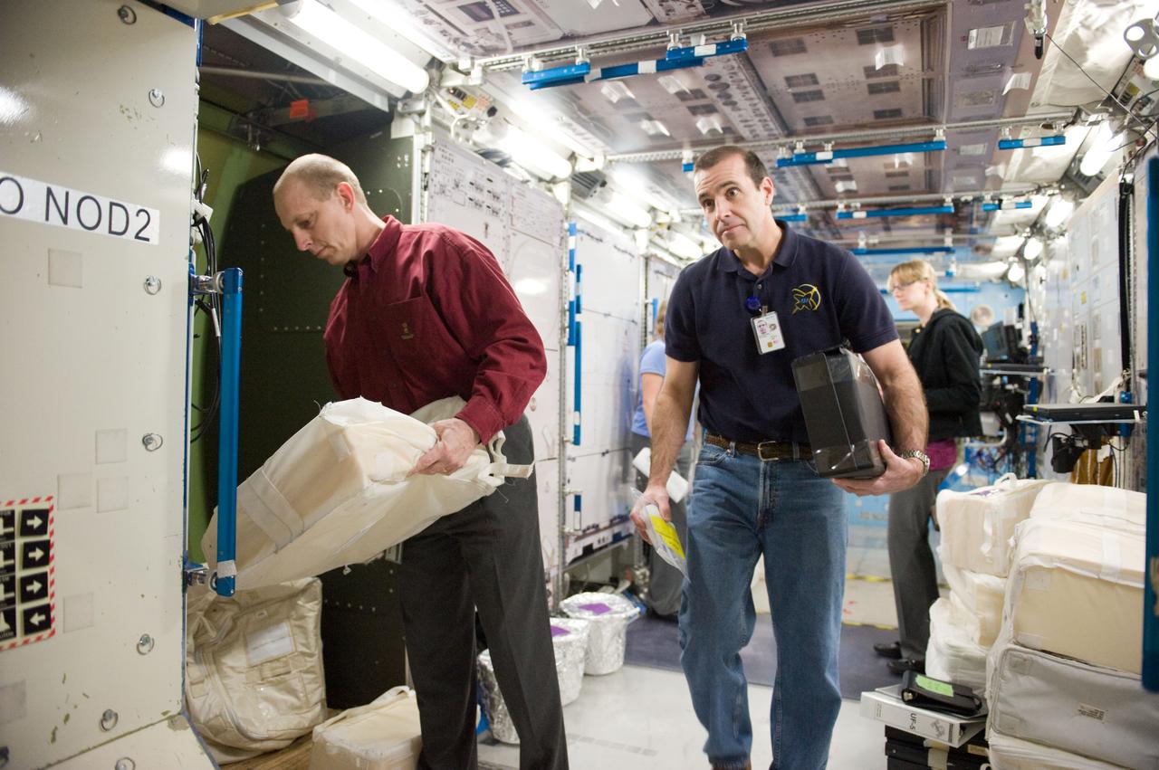 JSC2010-E-019460 (8 Feb. 2010) --- NASA astronauts Clayton Anderson (left) and Rick Mastracchio, both STS-131 mission specialists, participate in a training session in an International Space Station mock-up/trainer in the Space Vehicle Mock-up Facility at NASA's Johnson Space Center.