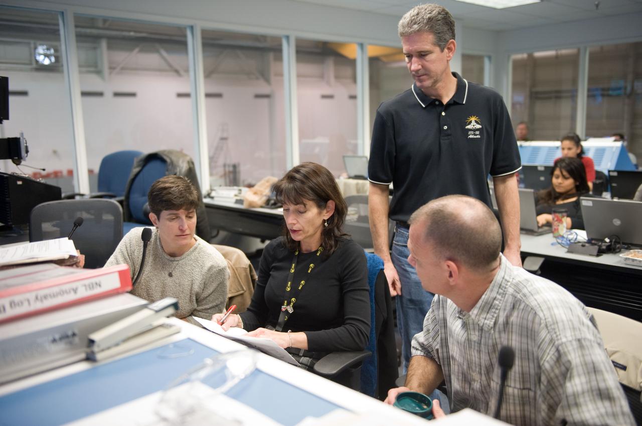 JSC2010-E-019628 (8 Feb. 2010) --- NASA astronauts Tony Antonelli (right), STS-132 pilot; and Michael Good, mission specialist, participate in a training session in the simulation control area in the Neutral Buoyancy Laboratory (NBL) at the Sonny Carter Training Facility near NASA's Johnson Space Center.