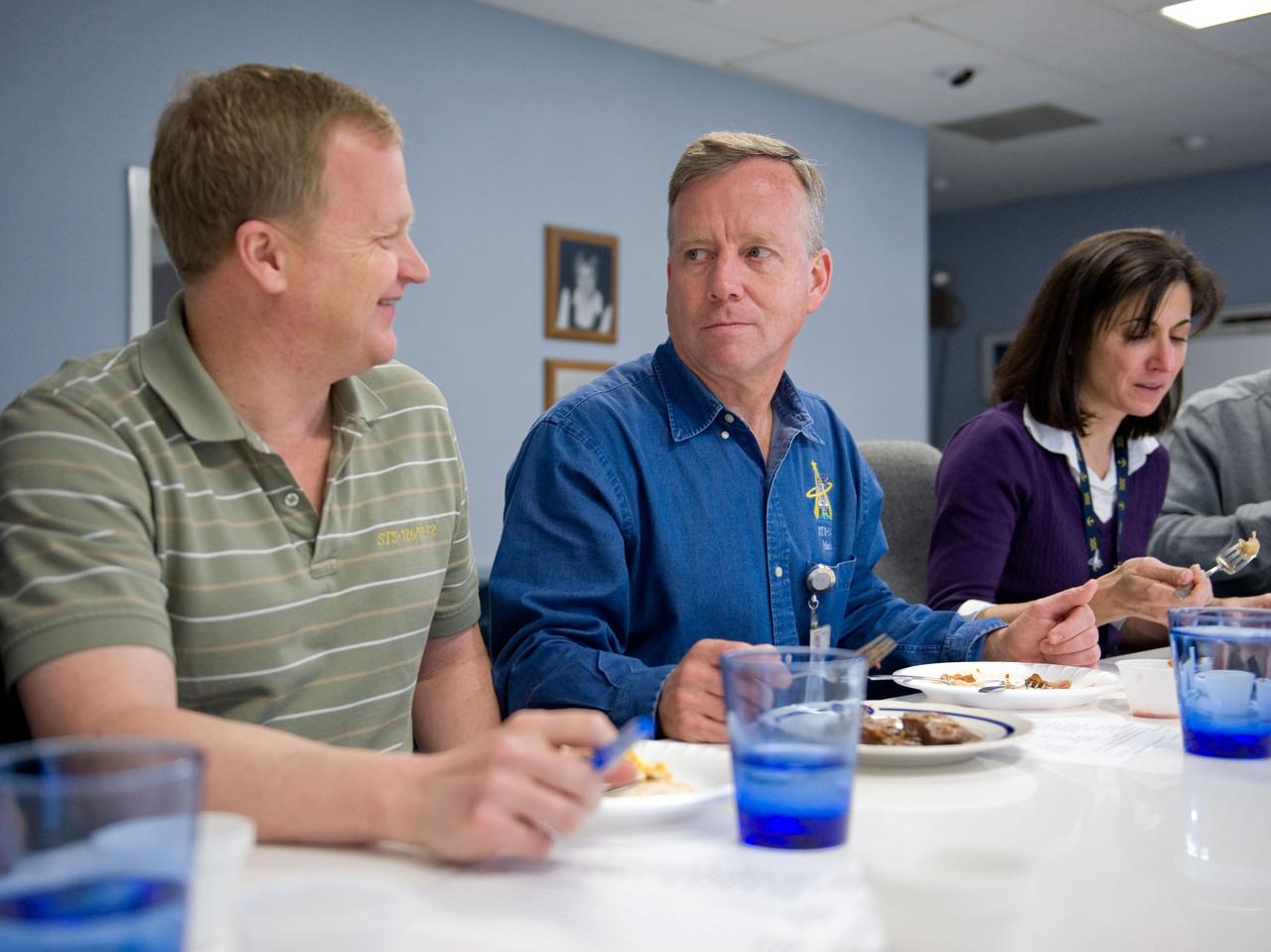 JSC2010-E-020617 (9 Feb. 2010) --- NASA astronauts Steve Lindsey (center), STS-133 commander; Eric Boe, pilot; and Nicole Stott, mission specialist, are pictured during a food tasting session in the Habitability and Environmental Factors Office at NASA's Johnson Space Center.