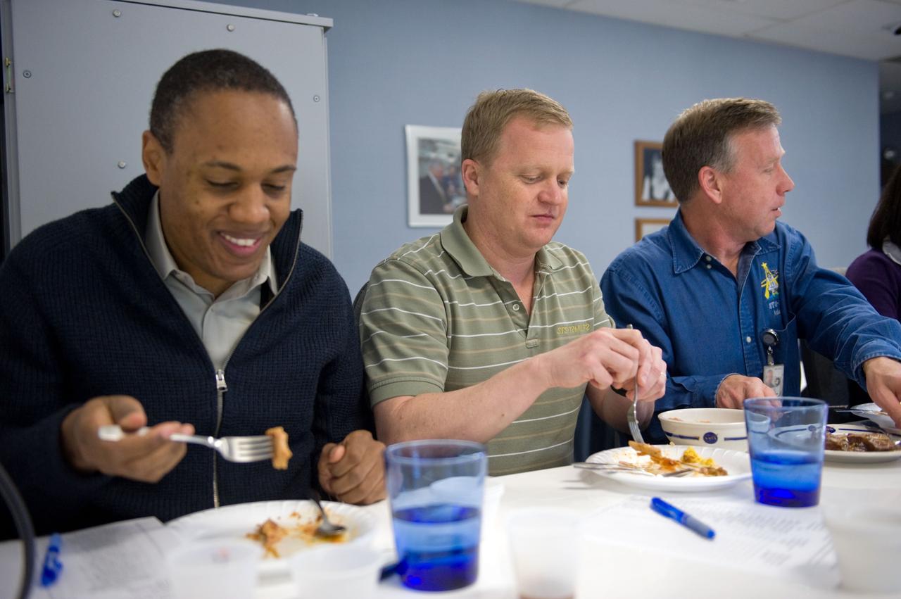 JSC2010-E-020618 (9 Feb. 2010) --- NASA astronauts Steve Lindsey (right), STS-133 commander; Eric Boe (center), pilot; and Alvin Drew, mission specialist, are pictured during a food tasting session in the Habitability and Environmental Factors Office at NASA's Johnson Space Center.