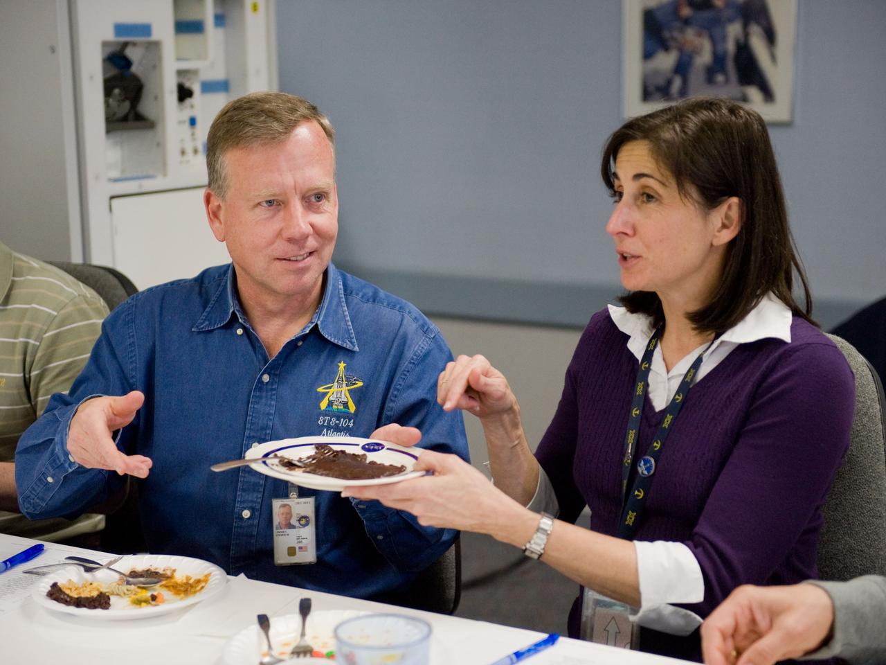 JSC2010-E-020626 (9 Feb. 2010) --- NASA astronauts Steve Lindsey, STS-133 commander; and Nicole Stott, mission specialist, are pictured during a food tasting session in the Habitability and Environmental Factors Office at NASA's Johnson Space Center.