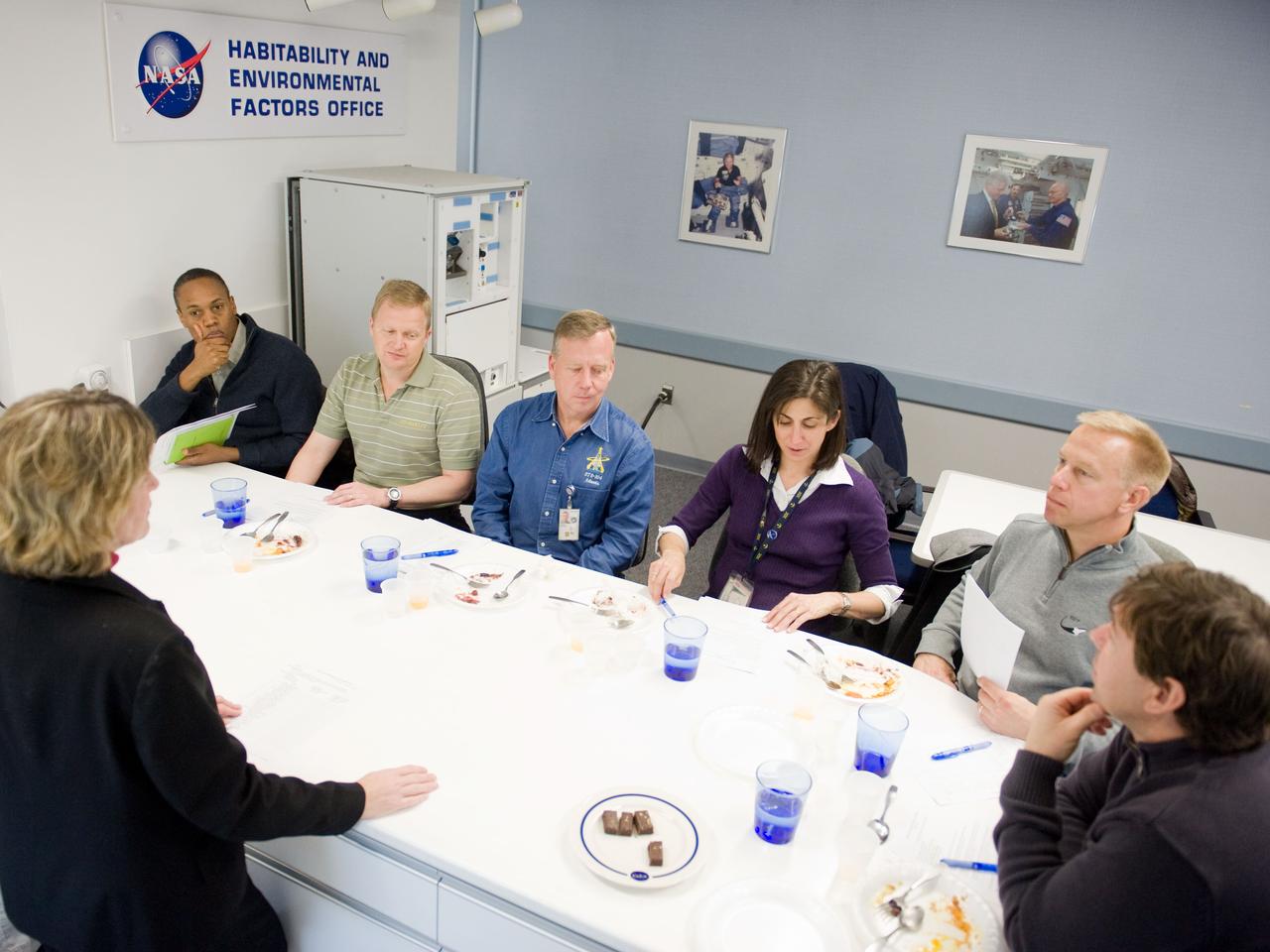 JSC2010-E-020632 (9 Feb. 2010) --- STS-133 crew members participate in a food tasting session in the Habitability and Environmental Factors Office at NASA's Johnson Space Center. Pictured seated from the left are NASA astronauts Alvin Drew, mission specialist; Eric Boe, pilot; Steve Lindsey, commander; Nicole Stott, Tim Kopra and Michael Barratt, all mission specialists.