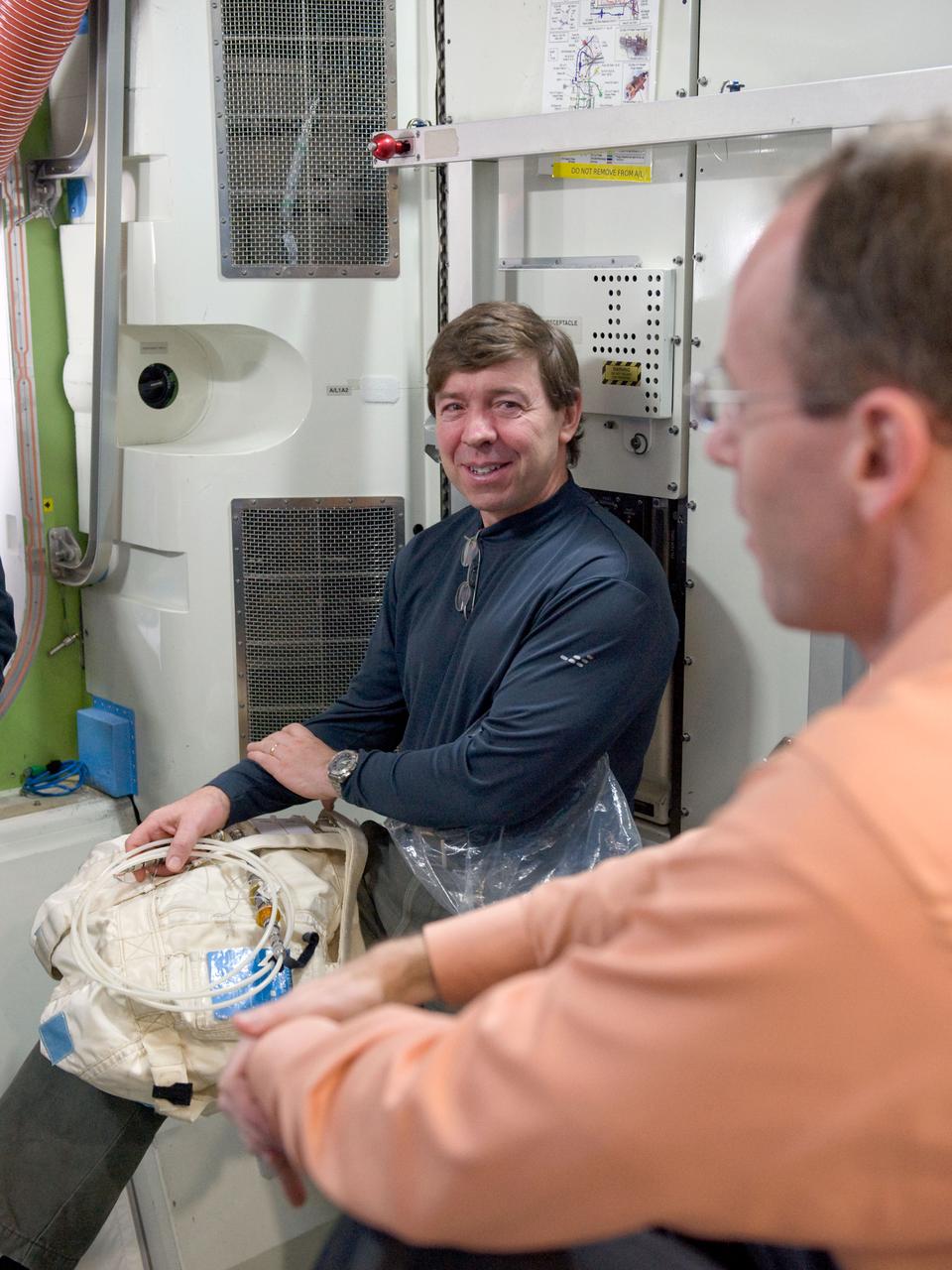 JSC2010-E-020709 (10 Feb. 2010) --- NASA astronaut Michael Barratt, STS-133 mission specialist, is pictured during a training session in an International Space Station mock-up/trainer in the Space Vehicle Mock-up Facility at NASA's Johnson Space Center.
