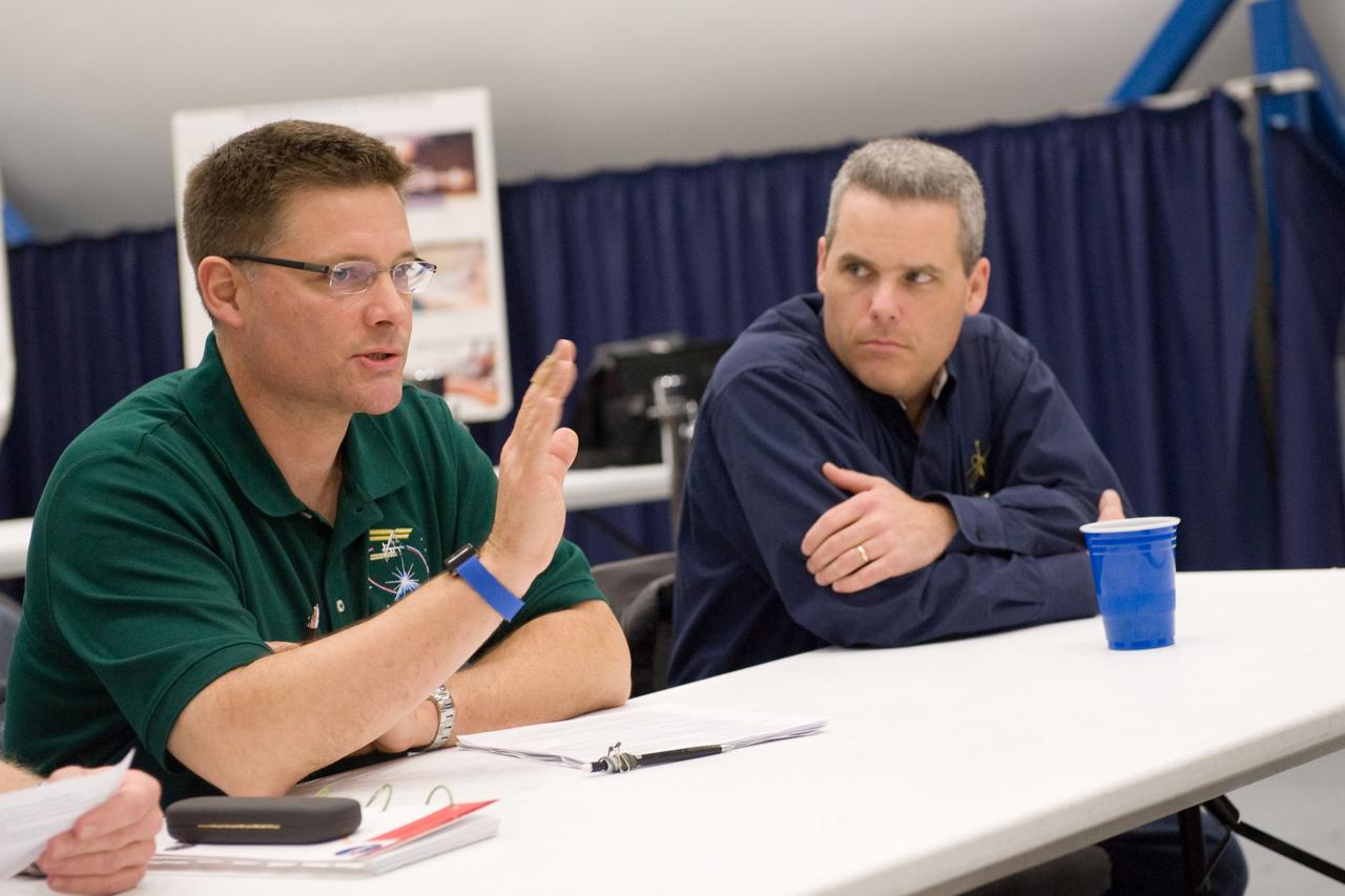 JSC2010-E-024373 (18 Feb. 2010) --- NASA astronaut Doug Wheelock (left), Expedition 24 flight engineer and Expedition 25 commander, participates in a training session in the Space Vehicle Mock-up Facility at NASA's Johnson Space Center. Flight director Brian T. Smith is at right.