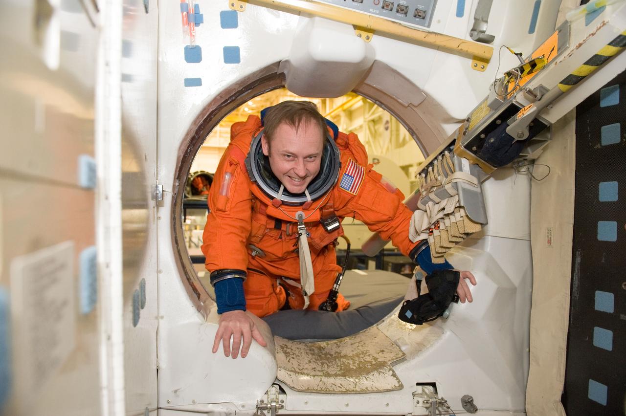 JSC2010-E-024593 (11 Feb. 2010) --- NASA astronaut Michael Fincke, STS-134 mission specialist, attired in a training version of his shuttle launch and entry suit, participates in a training session in the crew compartment trainer (CCT-2) in the Space Vehicle Mockup Facility at NASA's Johnson Space Center.