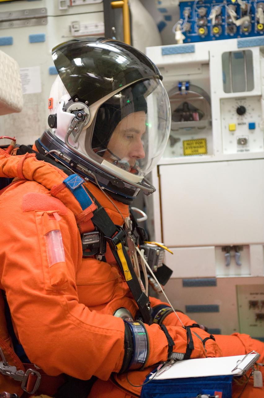 JSC2010-E-024597 (11 Feb. 2010) --- Attired in a training version of his shuttle launch and entry suit, NASA astronaut Andrew Feustel, STS-134 mission specialist, participates in a training session on the middeck of the crew compartment trainer (CCT-2) in the Space Vehicle Mockup Facility at NASA's Johnson Space Center.