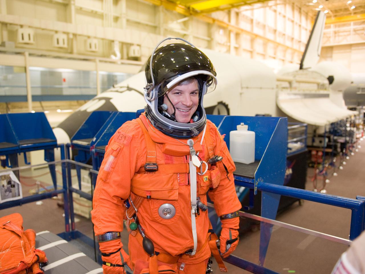 JSC2010-E-024601 (11 Feb. 2010) --- NASA astronaut Gregory H. Johnson, STS-134 pilot, attired in a training version of his shuttle launch and entry suit, is pictured during a training session in the Space Vehicle Mockup Facility at NASA's Johnson Space Center.