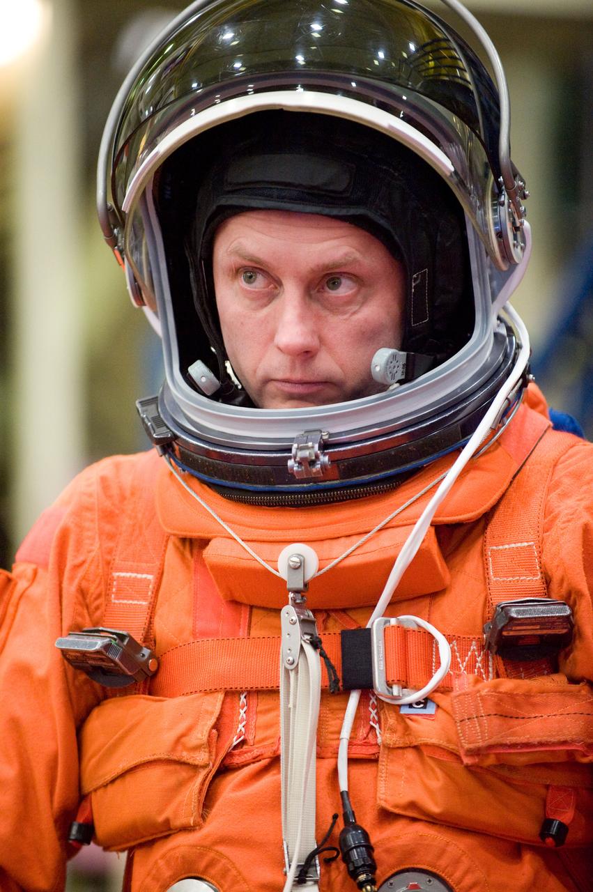 JSC2010-E-024605 (11 Feb. 2010) --- NASA astronaut Michael Fincke, STS-134 mission specialist, attired in a training version of his shuttle launch and entry suit, awaits the start of a training session in the crew compartment trainer (CCT-2) in the Space Vehicle Mockup Facility at NASA's Johnson Space Center.