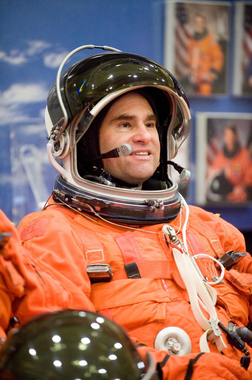 JSC2010-E-024606 (11 Feb. 2010) --- NASA astronaut Greg Chamitoff, STS-134 mission specialist, attired in a training version of his shuttle launch and entry suit, awaits the start of a training session in the crew compartment trainer (CCT-2) in the Space Vehicle Mockup Facility at NASA's Johnson Space Center.