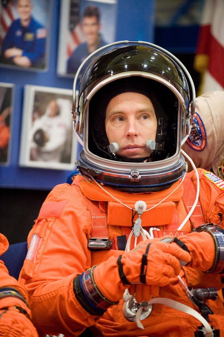 JSC2010-E-024608 (11 Feb. 2010) --- NASA astronaut Andrew Feustel, STS-134 mission specialist, attired in a training version of his shuttle launch and entry suit, awaits the start of a training session in the crew compartment trainer (CCT-2) in the Space Vehicle Mockup Facility at NASA's Johnson Space Center.