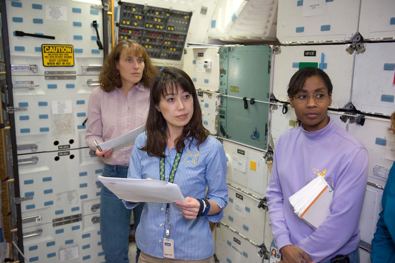 JSC2010-E-024624 (10 Feb. 2010) --- Japan Aerospace Exploration Agency (JAXA) astronaut Naoko Yamazaki (center), along with NASA astronauts Dorothy Metcalf-Lindenburger (background) and Stephanie Wilson, all STS-131 mission specialists, participate in an ingress/egress timeline training session in a shuttle mock-up in the Space Vehicle Mock-up Facility at NASA's Johnson Space Center.