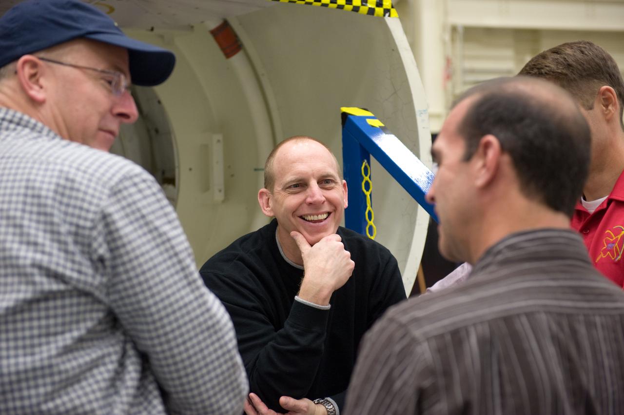 JSC2010-E-024628 (10 Feb. 2010) --- NASA astronauts Alan Poindexter (left), STS-131 commander; Clayton Anderson (facing camera) and Rick Mastracchio, both mission specialists; along with James P. Dutton Jr. (mostly out of frame at right), pilot, participate in an ingress/egress timeline training session in the Space Vehicle Mock-up Facility at NASA's Johnson Space Center.