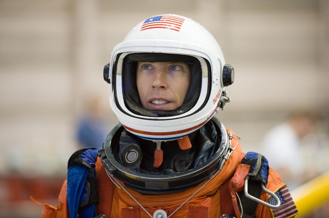 JSC2010-E-025760 (23 Feb. 2010) --- Attired in a training version of his shuttle launch and entry suit, NASA astronaut Andrew Feustel, STS-134 mission specialist, is pictured during a water survival training session in the Neutral Buoyancy Laboratory (NBL) near NASA's Johnson Space Center.