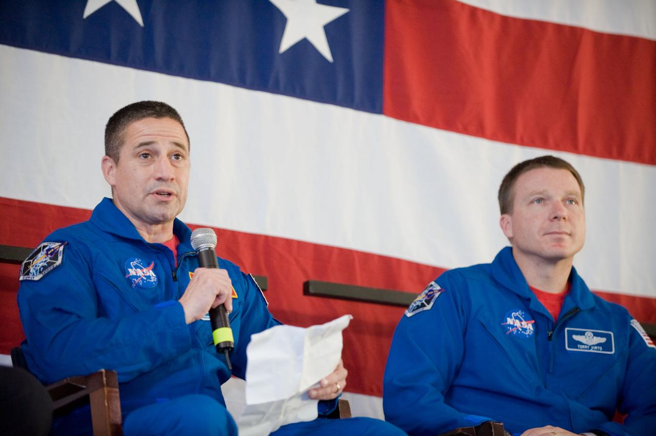 JSC2010-E-025786 (22 Feb. 2010) --- NASA astronaut George Zamka, STS-130 commander, addresses a large crowd of well-wishers at the STS-130 crew return ceremony on Feb. 22, 2010 at Ellington Field near NASA?s Johnson Space Center. Astronaut Terry Virts, pilot, is at right.