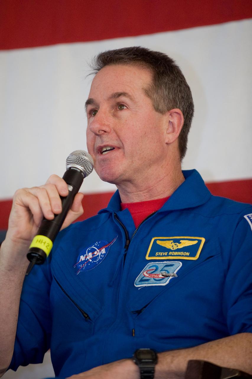 JSC2010-E-025794 (22 Feb. 2010) --- NASA astronaut Stephen Robinson, STS-130 mission specialist, addresses a large crowd of well-wishers at the STS-130 crew return ceremony on Feb. 22, 2010 at Ellington Field near NASA?s Johnson Space Center.