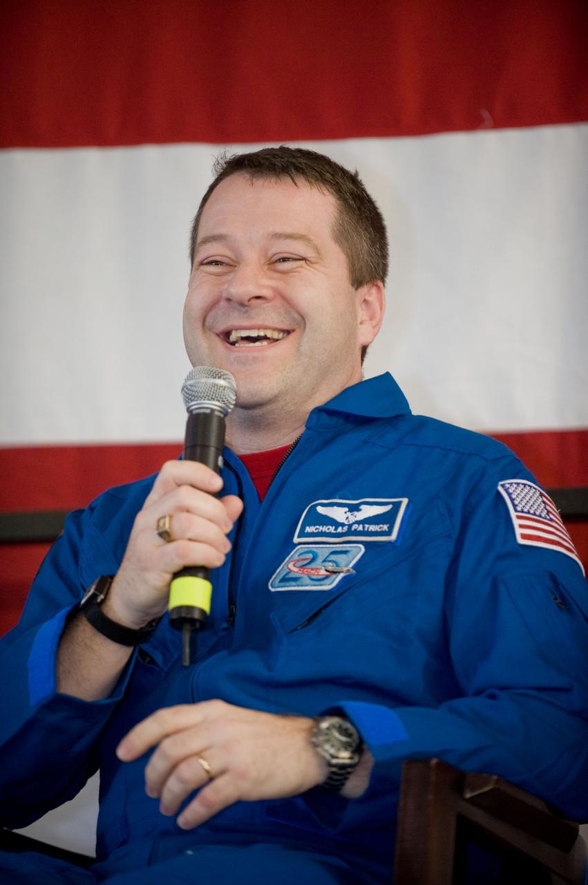 JSC2010-E-025796 (22 Feb. 2010) --- NASA astronaut Nicholas Patrick, STS-130 mission specialist, addresses a large crowd of well-wishers at the STS-130 crew return ceremony on Feb. 22, 2010 at Ellington Field near NASA?s Johnson Space Center.