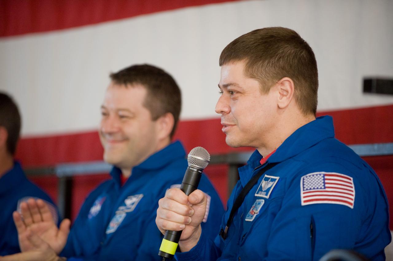 JSC2010-E-025798 (22 Feb. 2010) --- NASA astronaut Robert Behnken, STS-130 mission specialist, addresses a large crowd of well-wishers at the STS-130 crew return ceremony on Feb. 22, 2010 at Ellington Field near NASA?s Johnson Space Center. Astronaut Nicholas Patrick, mission specialist, is at left.