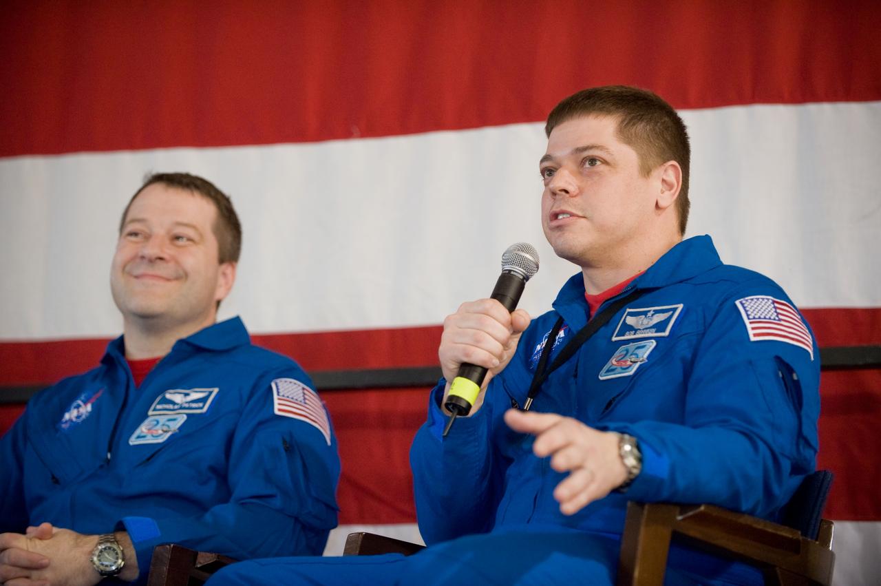 JSC2010-E-025799 (22 Feb. 2010) --- NASA astronaut Robert Behnken, STS-130 mission specialist, addresses a large crowd of well-wishers at the STS-130 crew return ceremony on Feb. 22, 2010 at Ellington Field near NASA?s Johnson Space Center. Astronaut Nicholas Patrick, mission specialist, is at left.