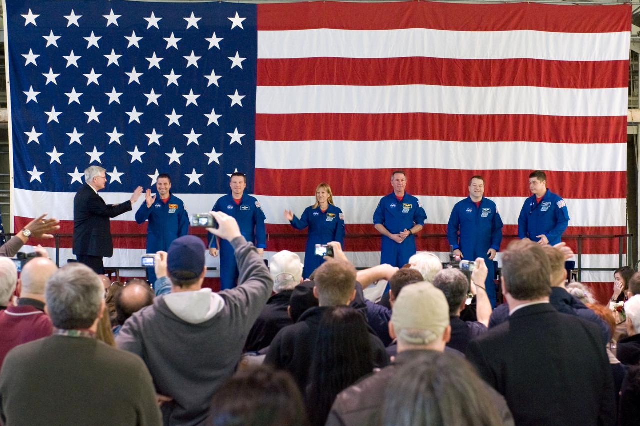 JSC2010-E-025814 (22 Feb. 2010) --- NASA's Johnson Space Center (JSC) director Michael L. Coats (left) and the STS-130 crew members are pictured at the STS-130 crew return ceremony on Feb. 22, 2010 at Ellington Field near JSC. From the second left are NASA astronauts George Zamka, commander; Terry Virts, pilot; Kathryn Hire, Stephen Robinson, Nicholas Patrick and Robert Behnken, all mission specialists.